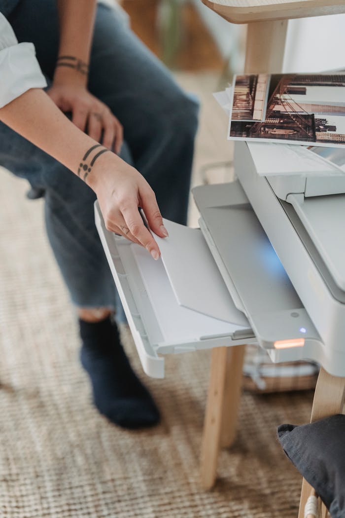Crafting Captivating Headlines: Your awesome post title goes here From above of crop unrecognizable female putting sheets of paper in printer for work